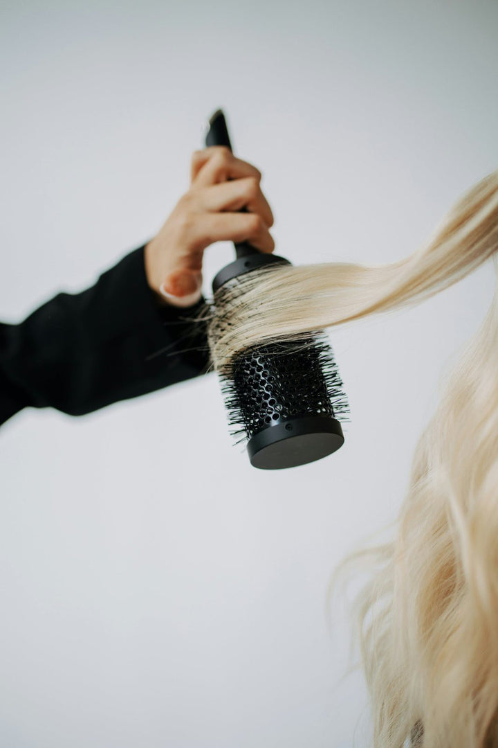 Blow-dry finish on long blonde hair
