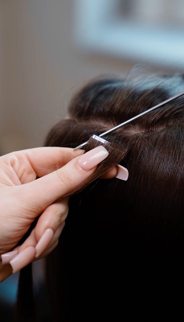 Tape-in hair extension being applied at RH Salon